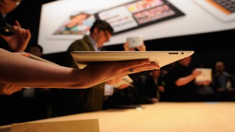 Members of the media test Apple's new iPad tablet at a launch event March 7 in San Francisco.