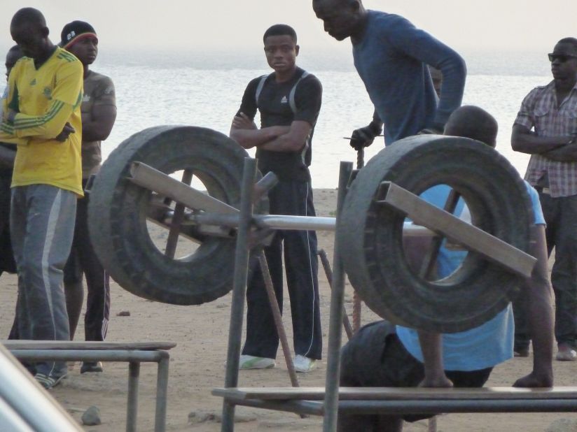 Lacking the money to use a proper gym, some men have built a makeshift gym of their own using whatever materials they can, such as car tires.