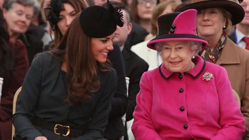 Queen Elizabeth II and Duchess of Cambridge watch a fashion show at on March 8, 2012 in Leicester