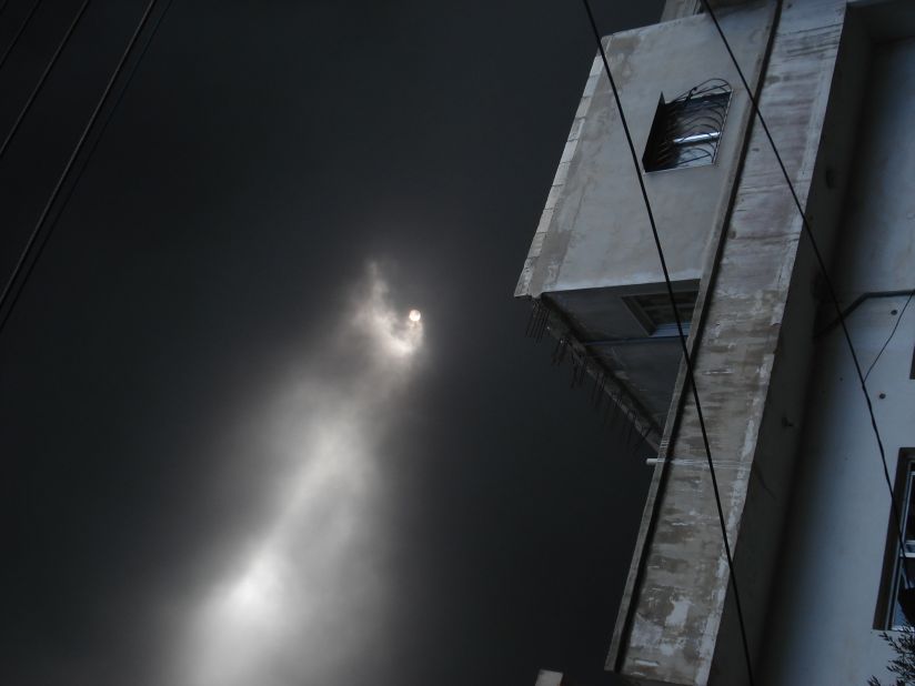 Dense smoke blocks the sun from shining in Homs, the Syrian city that has been the center of a military crackdown on anti-reginme activists.