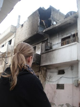 CNN correspondent Arwa Damon walks through battered and defiant Homs, Syria.