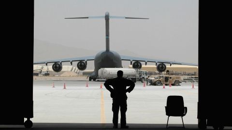 A member of the Afghan air force stands in the doorway of a hangar in Kandahar, Afghanistan, on July 3, 2010.