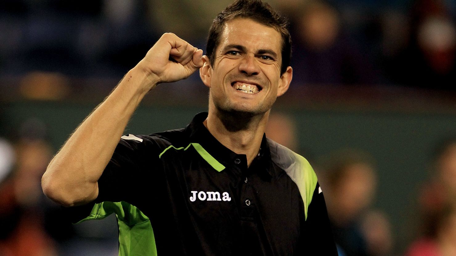 Guillermo Garcia-Lopez celebrates his comfortable straight sets victory over fourth seed Andy Murray in California.
