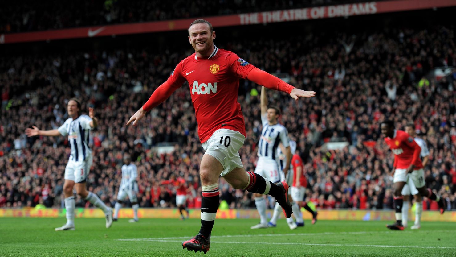 Wayne Rooney celebrates scoring the first of his two goals as Manchester United went top of the English Premier League.