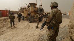 U.S. soldiers guard a military base near Alkozai village after the shooting of Afghan civilians in Panjwayi district, Kandahar on March 11, 2012. 