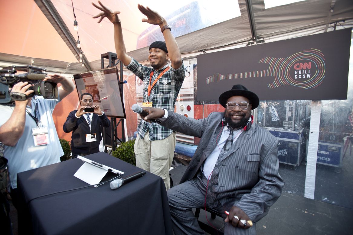 DJ Spooky and George Clinton get crowd feedback during their set Sunday.