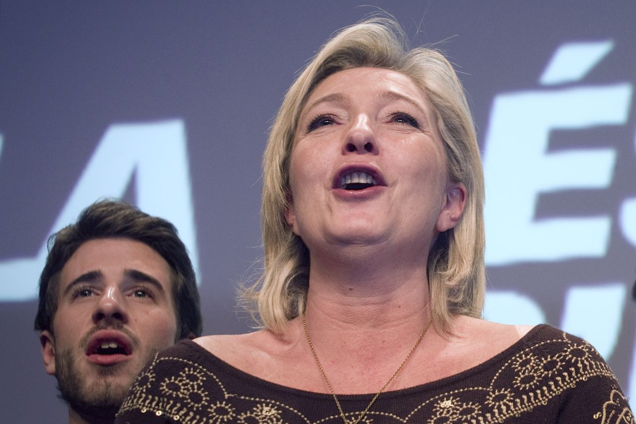 Marine Le Pen sings the French national anthem at her party's convention in Lille on February 18, 2012.