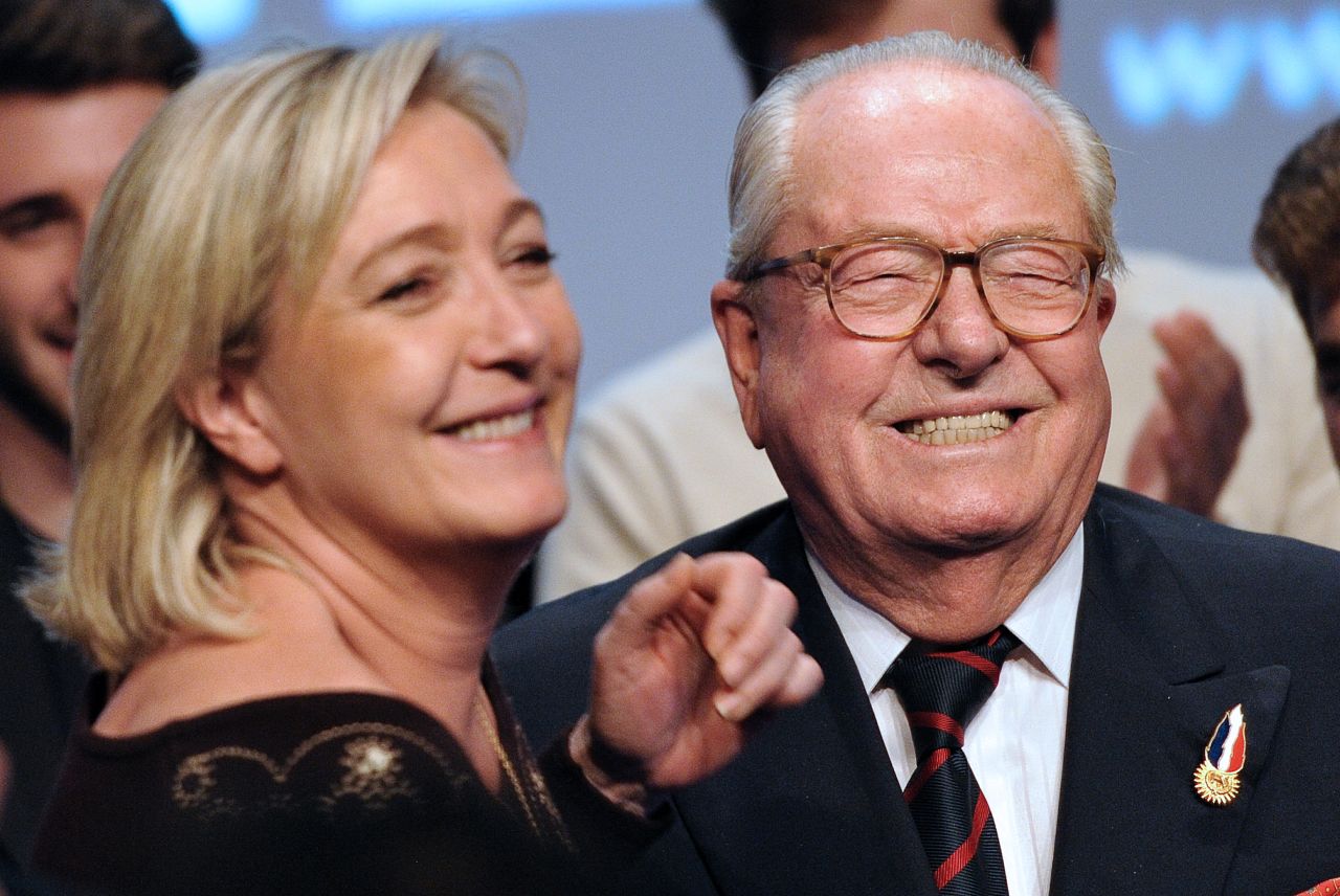 National Front Honorary President Jean-Marie Le Pen and his daughter Marine smile during the party's convention in Lille in February 2012.