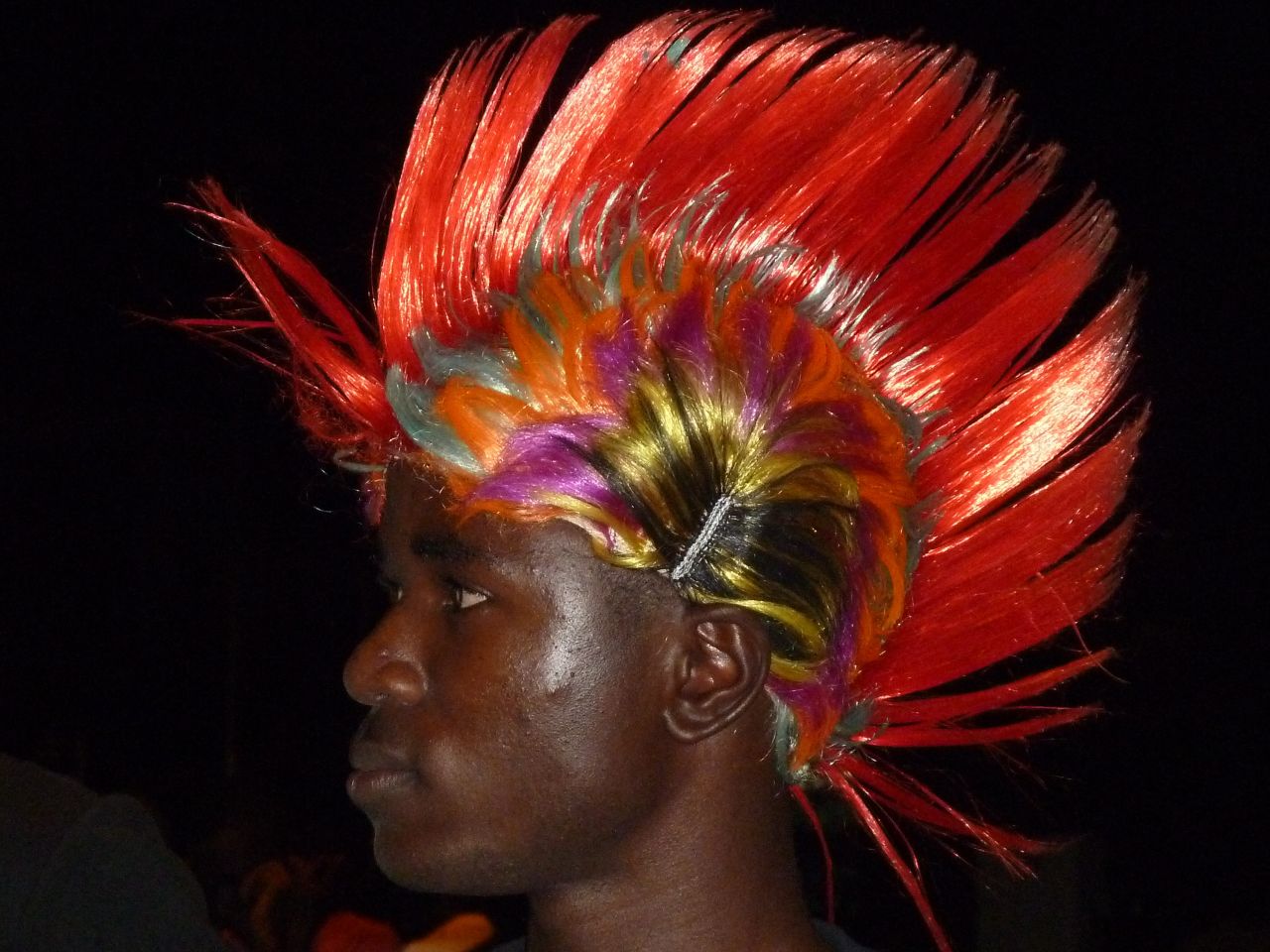 A young man stands out in Libreville during a concert.