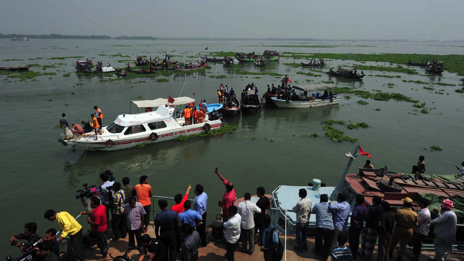 Rescue workers search for missing passengers Tuesday after a ferry accident in Bangladesh's Munshiganj district.