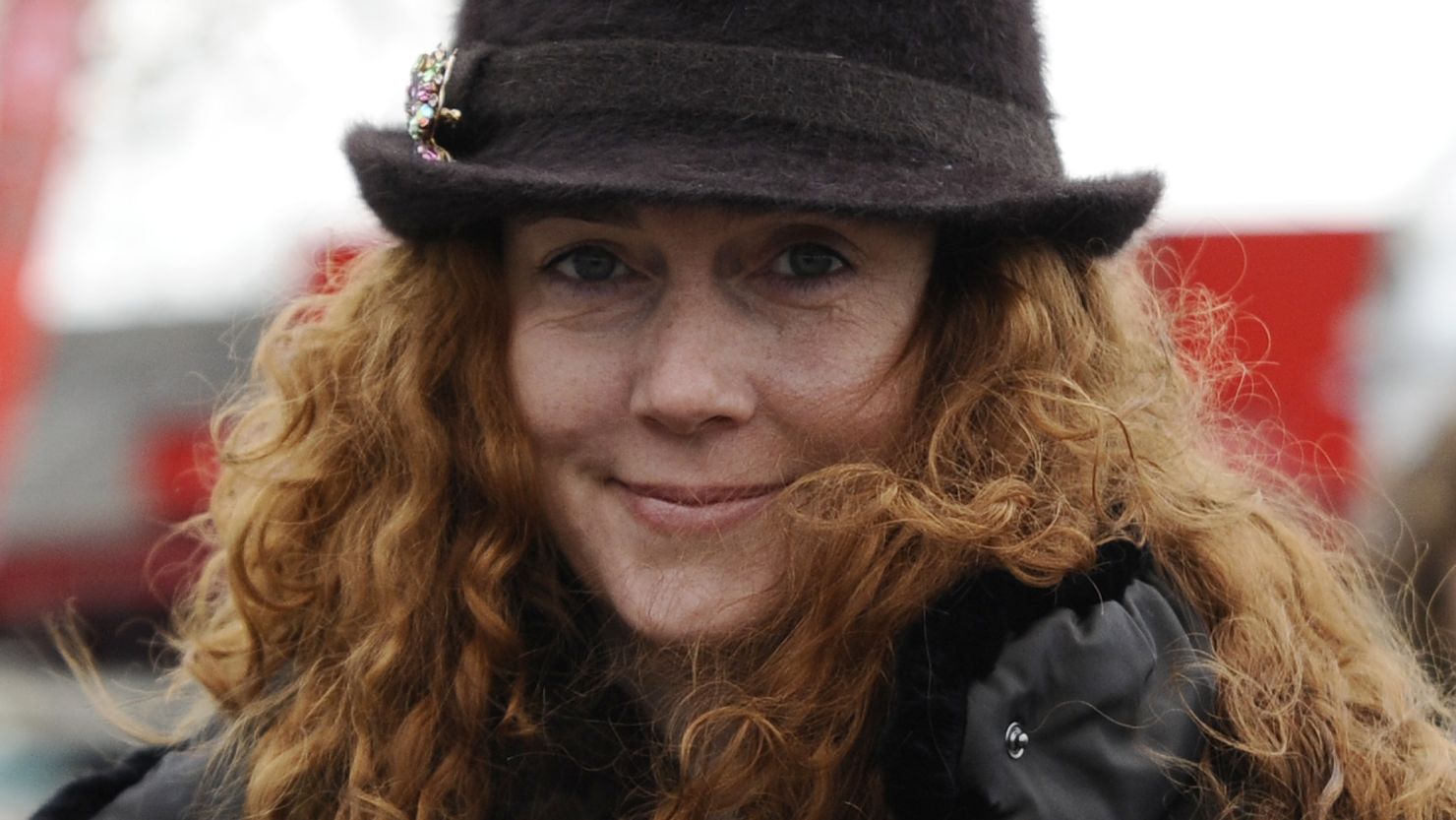 A day after Rebekah Brooks' arrest, a 51-year-old man was arrested on Wednesday on suspicion of intimidation of a witness