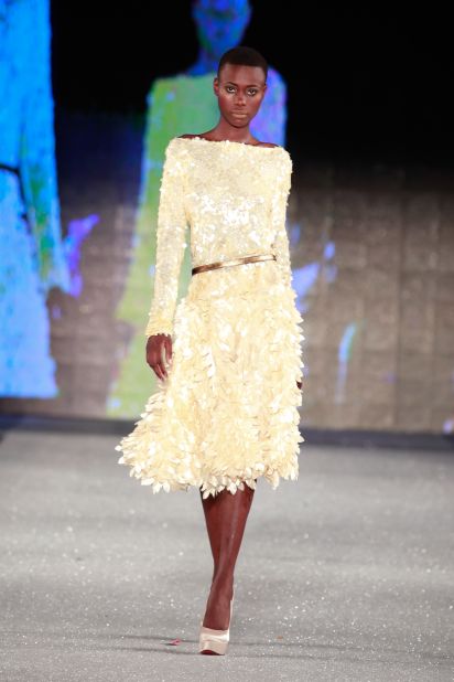A model takes to the catwalk wearing a creation of South African designer Gavin Rajah.