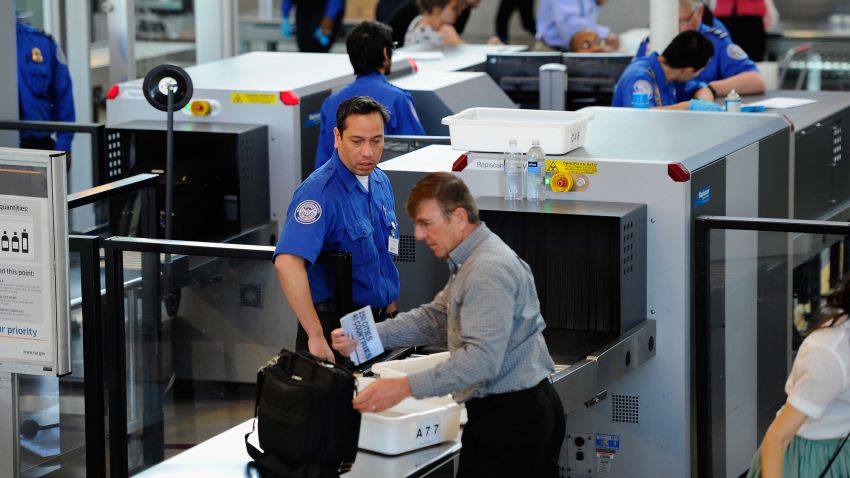 	LOS ANGELES, CA - MAY 02: Transportation Security Administration (TSA) agents screen passengers at Los Angeles International Airport on May 2, 2011 in Los Angeles, California. Security presence has been escalated at airports, train stations and public places after the killing of Osama Bin Laden by the United States in Abbottabad, Pakistan. (Photo by Kevork Djansezian/Getty Images) 