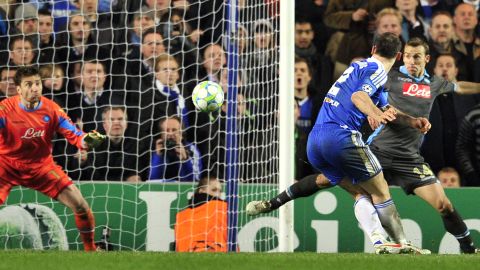 Branislav Ivanovic strikes home Chelsea's clinching goal against Napoli in their last 16 Champions League tie.