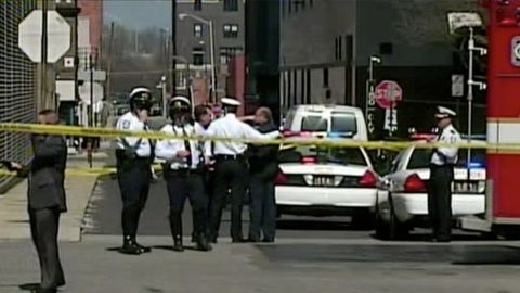 Columbus, Ohio, police confer at the scene of a multiple stabbing Wednesday. Police shot and wounded the suspect.