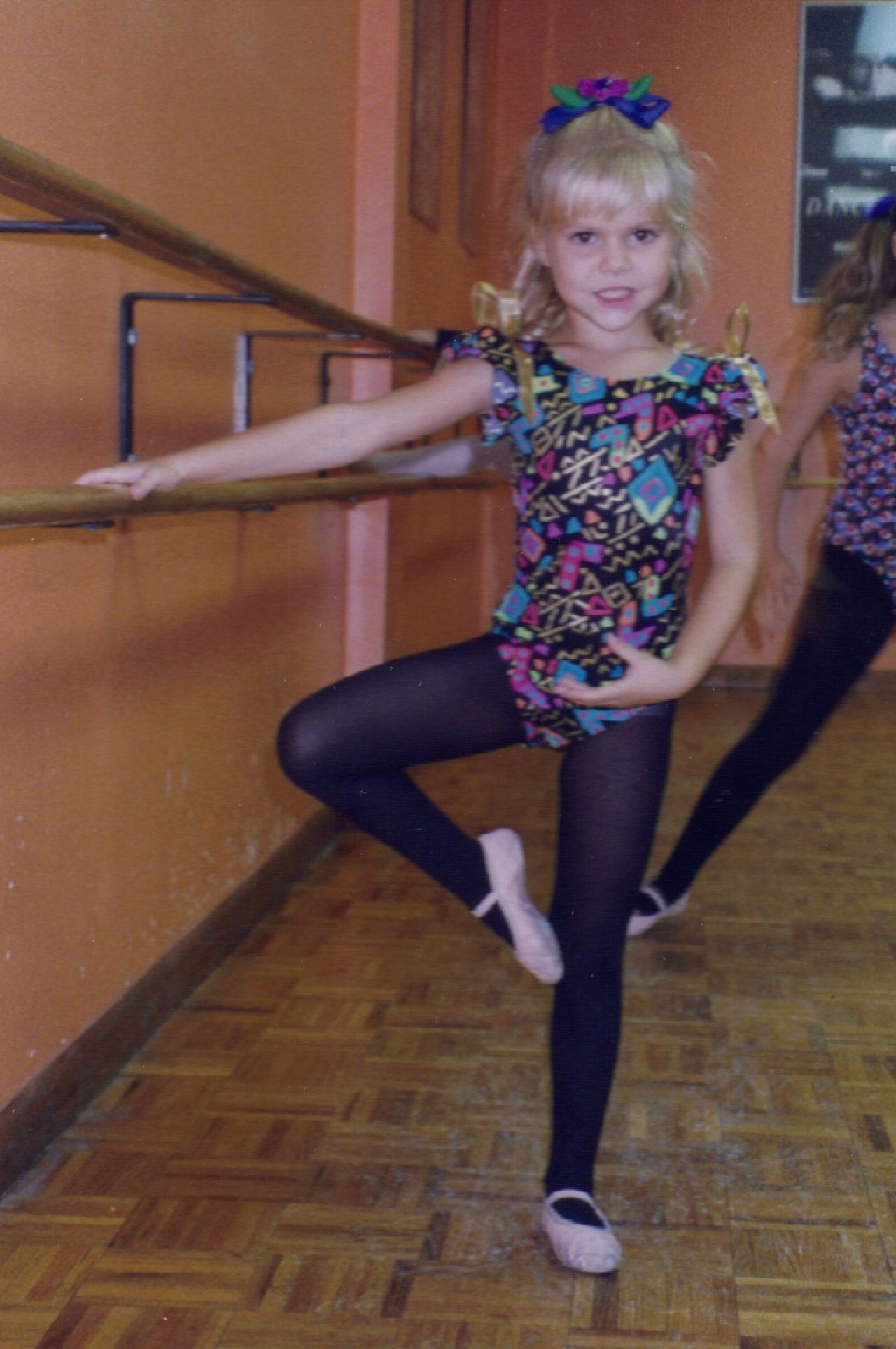 A young Kirsten strikes a ballet pose. She once dreamed of becoming a famous ballerina.