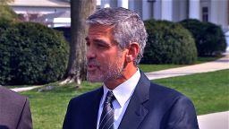 Clooney talks to the press after meeting with the president Thursday.