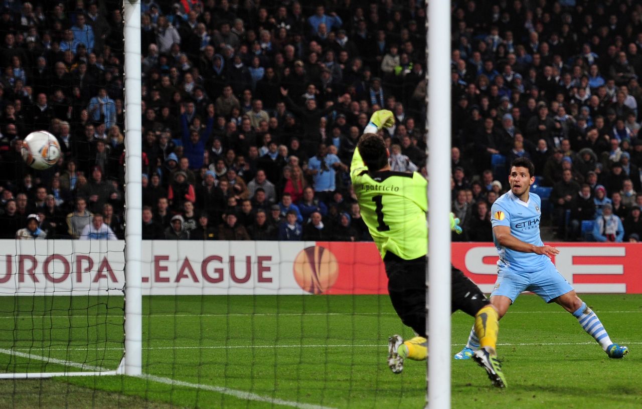 Sergio Aguero fires home Manchester City's third goal against Sporting Lisbon in the last-16 Europa League tie at the Etihad Stadium. A valiant second-half comeback wasn't enough to send City crashing out on the away goals rule. 