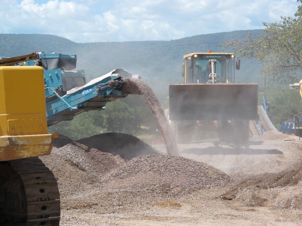 Vehicles moving earth in a mine owned by Marange Resources, one of the four companies operating in the area.