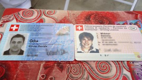 The Swiss identity cards of a couple, kidnapped by the Taliban, appear on a table at a police station in Quetta, Pakistan, in July.