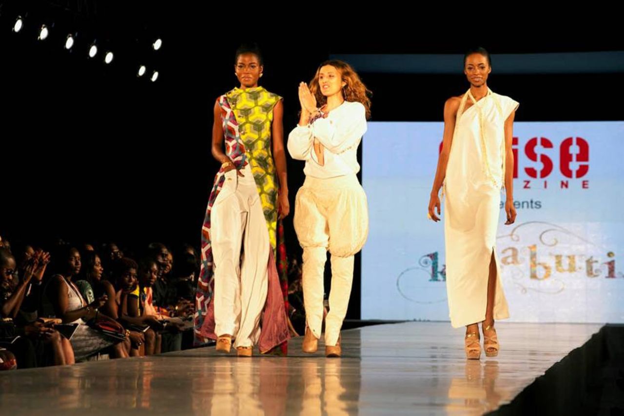 Caterina Bortolussi (center), designer for Kinabuti, joins the models on stage at the end of her show.