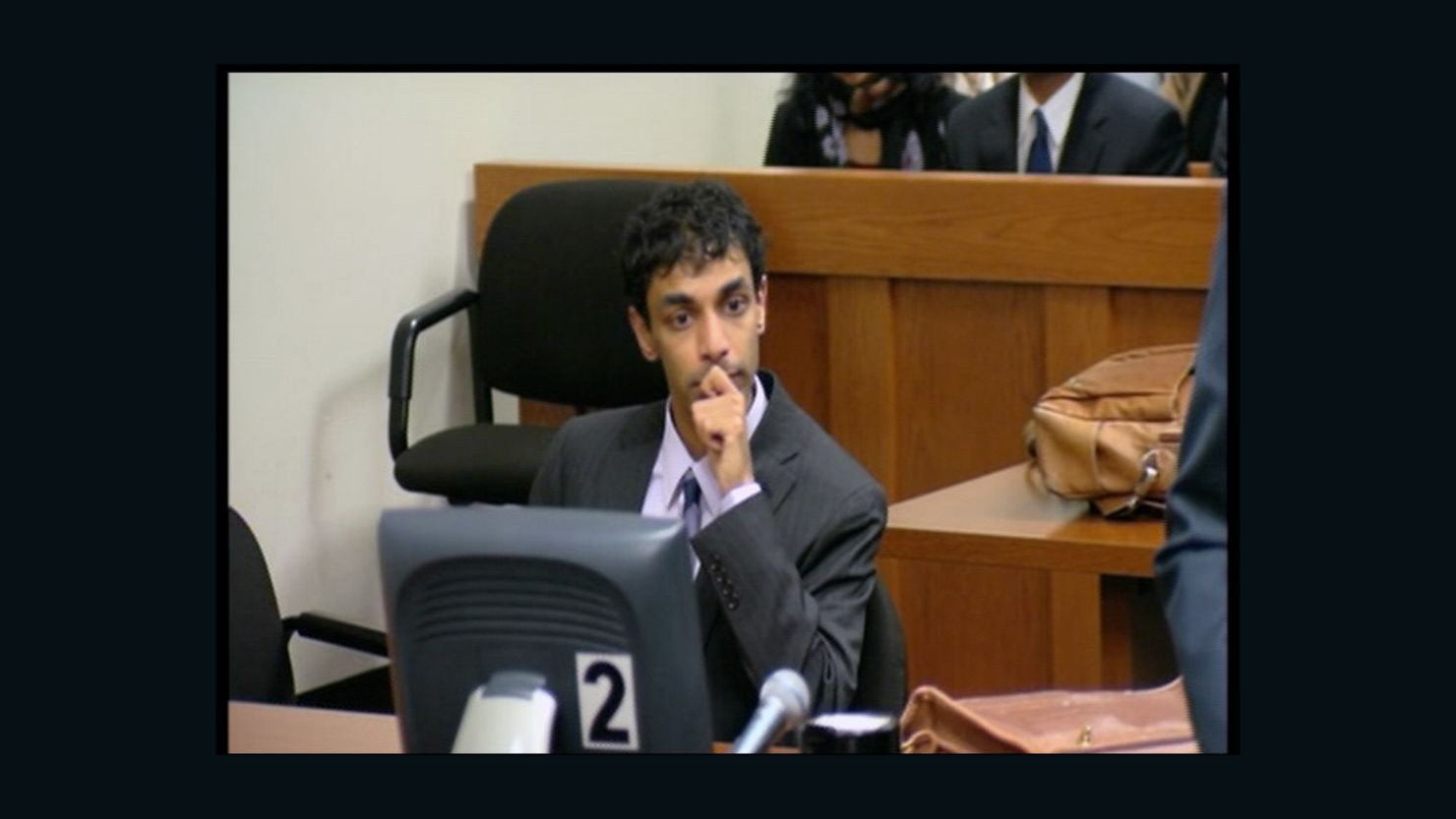 Former Rutgers University student Dharun Ravi listens as a jury finds him guilty of invasion of privacy and bias intimidation.