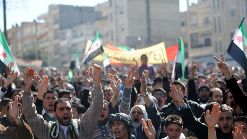 Syrian demonstrators shout slogans during an anti-regime protest in the centre of Idlib in northwestern Syria on February 24, 2012.