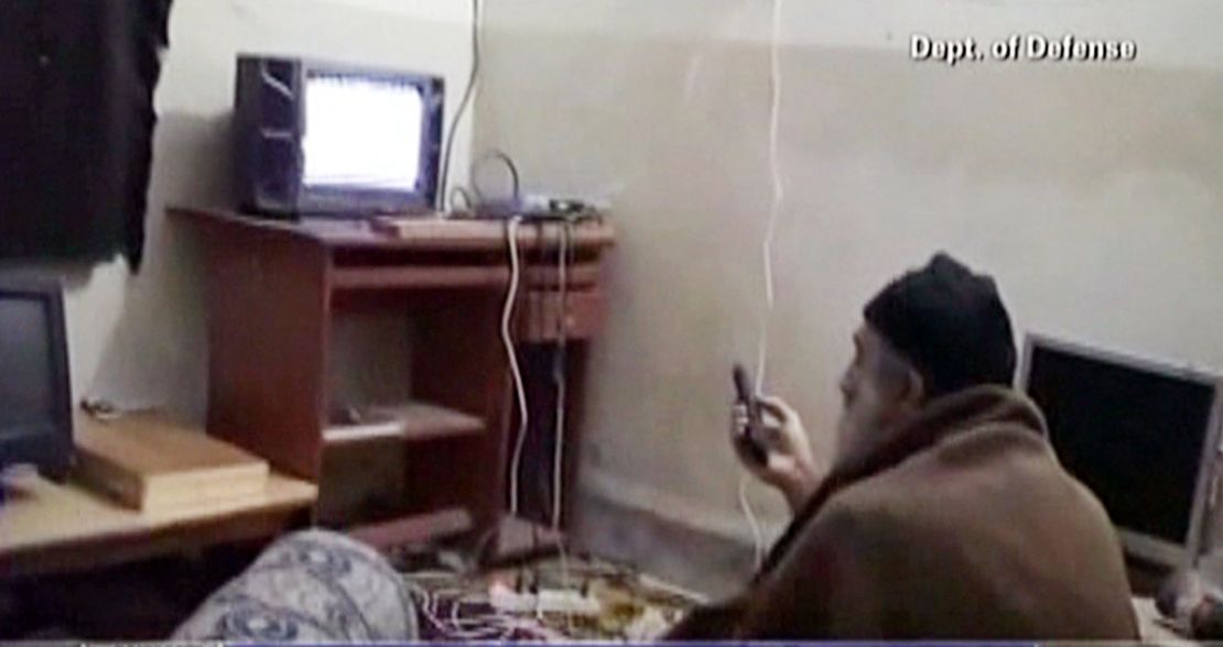 Bin Laden watches TV at his Abbottabad, Pakistan, compound in a frame grab from an undated video from the Pentagon. 