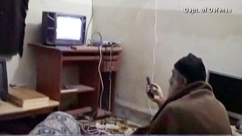 Bin Laden watches TV at his Abbottabad, Pakistan, compound in a frame grab from an undated video from the Pentagon. 