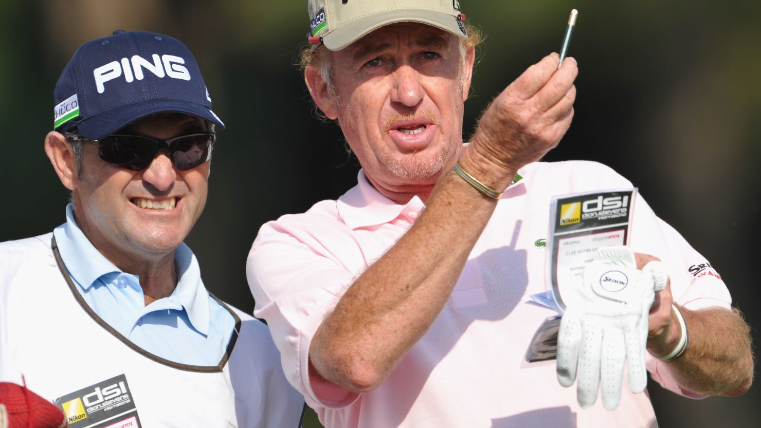 Miguel Angel Jimenez discusses tactcs with his caddie during the second round of the Andalucia Open.