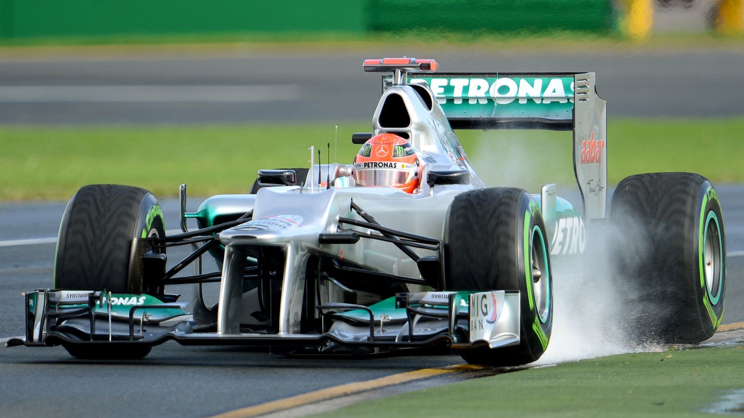 Seven-time world champion Michael Schumacher was fastest in wet practice conditions in Melbourne on Friday.