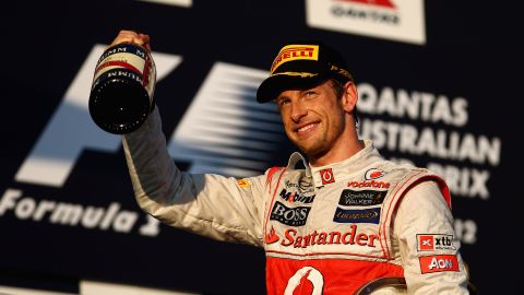 Jenson Button celebrates victory in the Australian Grand Prix, his third Melbourne win in four years.