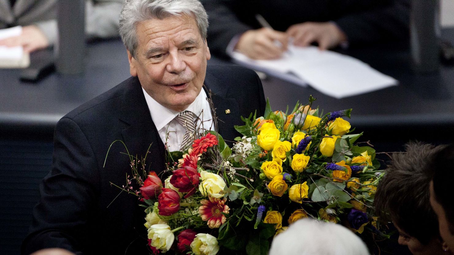 Joachim Gauck is congratulated by members of the Bundestag after being elected German president.