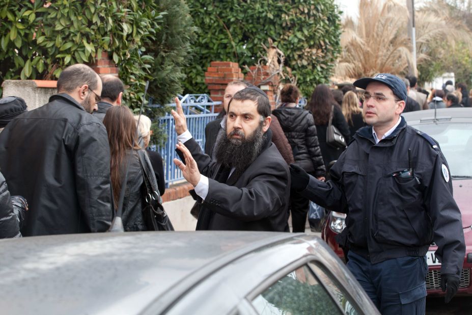 Rabbi Rav Gabriel directs families to the scene of the fatal shooting on Monday. France, which has one of the largest Jewish populations in Europe, had 389 reported acts of anti-Semitism in 2011, according to Representative Council of Jewish Institutions in France.