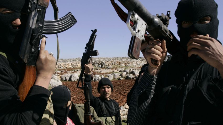 Syrian rebels man a check-point in the north of northern Syria's Idlib region, on March 18, 2012. 