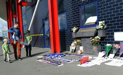 Bolton Wanderers fans have left flowers and scarves outside the English club's Reebok Stadium in support of Muamba, while most of the playing squad have been to visit him in the London Chest Hospital.