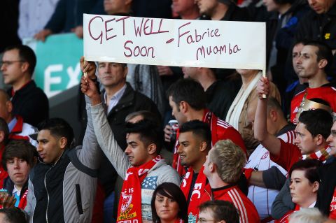 Fans at Liverpool's FA Cup quarterfinal against Stoke City send their best wishes to Muamba. Supporters also chanted his name at various points during Sunday's Anfield match.