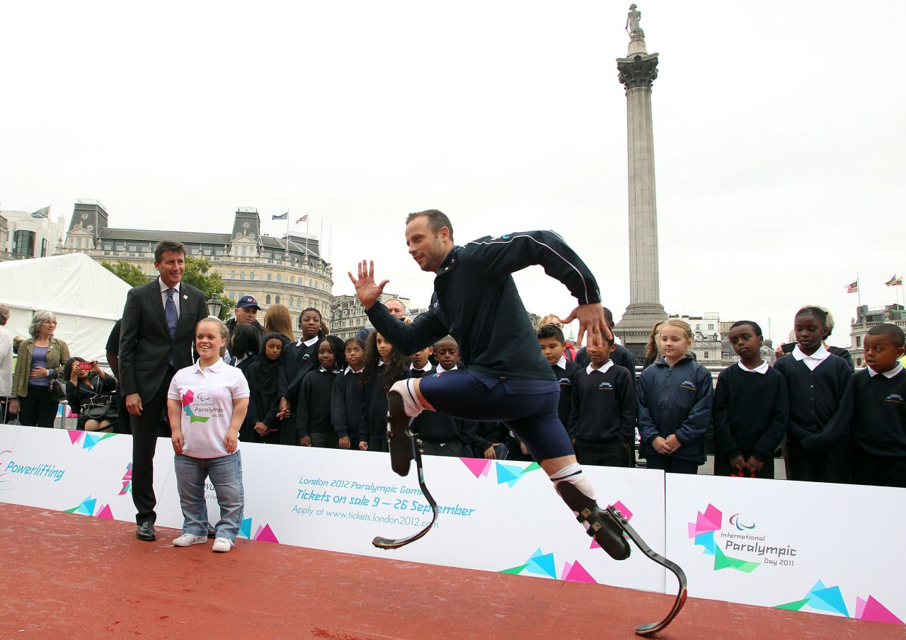 Pistorius demonstrates his sprinting skills to London Olympic chief Sebastian Coe at an event to launch the 2012 Paralympic Games.