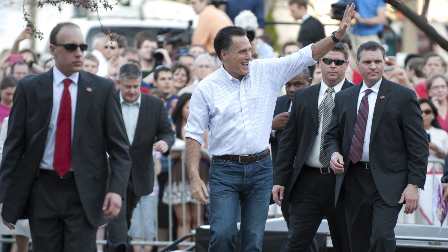 Mitt Romney waves to supporters Monday at Bradley University in Peoria, Illinois. 