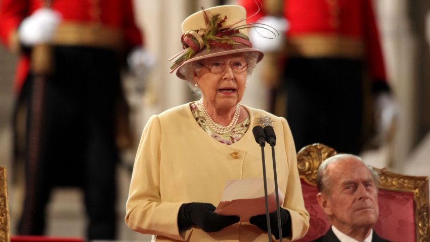 Queen Elizabeth II addresses both Houses of Parliament as Prince Philip, looks on, in Westminster Hall.