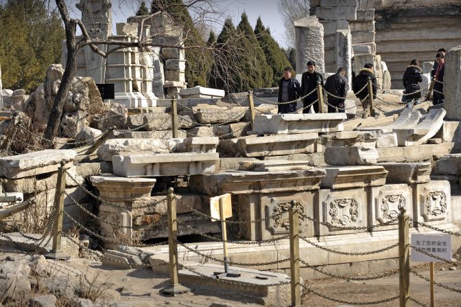 Visitors are seen walking through the ruins of Haiyan Hall in the old imperial Summer Palace on the outskirts of Beijing.