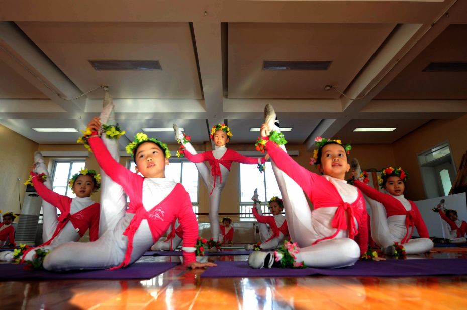 Like music, sport and education, ballet training starts young in China. Here, a group of Chinese children takes ballet class at an exclusive kindergarten in Beijing.