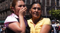 A woman comforts another at El Zocalo square in Mexico City on Tuesday after a 7.4-magnitude earthquake struck southwest Mexico, causing residents in the capital several hundred miles away to rush out onto the streets. The quake struck near the tourist resort of Acapulco, just after midday some 25 kilometers northeast of the town of Ometepec, the U.S. Geological Survey said. 