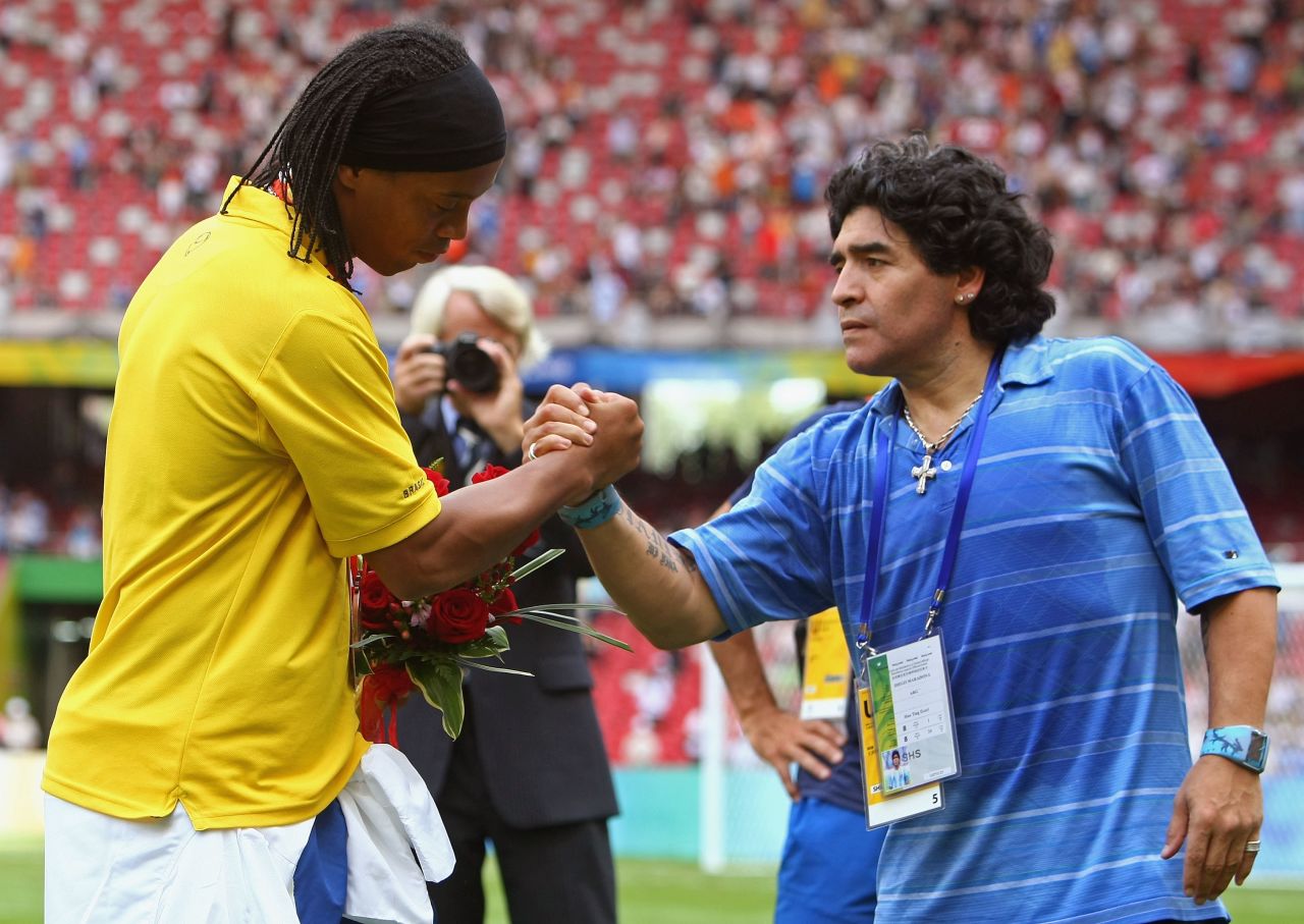 Brazil star Ronaldinho greets Argentina great Diego Maradona after receiving his bronze medal at the 2008 Beijing Olympics. The former Barcelona star has been included as an overage player in Brazil's provisional squad for London 2012.
