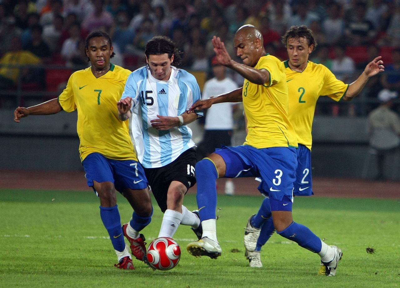 Anderson, left, and his Brazil teammates try to take the ball off Lionel Messi in the 2008 Olympic semifinal against Argentina, who won 3-0 and went on to take gold.