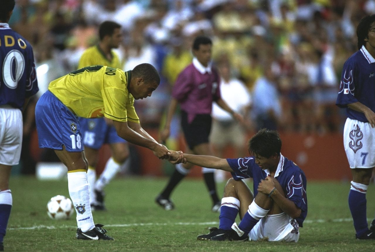 However, Olympic success has eluded the "Samba Boys." Ronaldo, here helping a Japan player to his feet during Brazil's 1-0 loss, won a bronze medal at Atlanta 1996. He went on to win the World Cup in 2002 and become the tournament's record overall scorer.