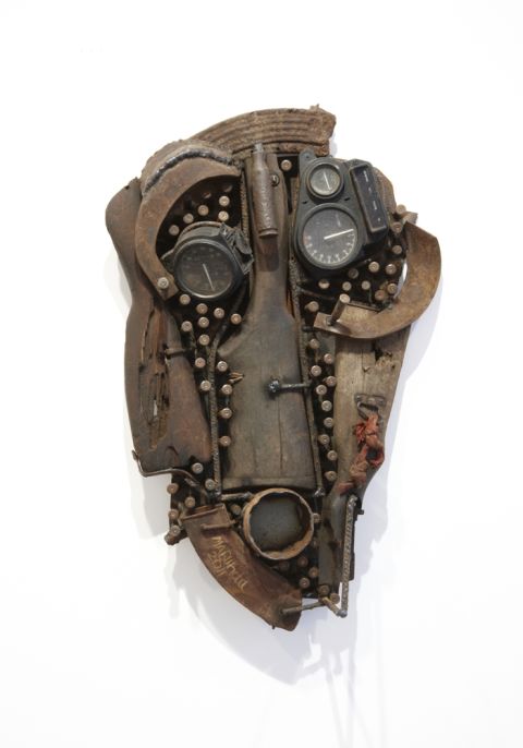 A tribal-inspired mask made from a rifle butt, bullets and other military equipment by Mozambican sculptor Goncalo Mabunda.