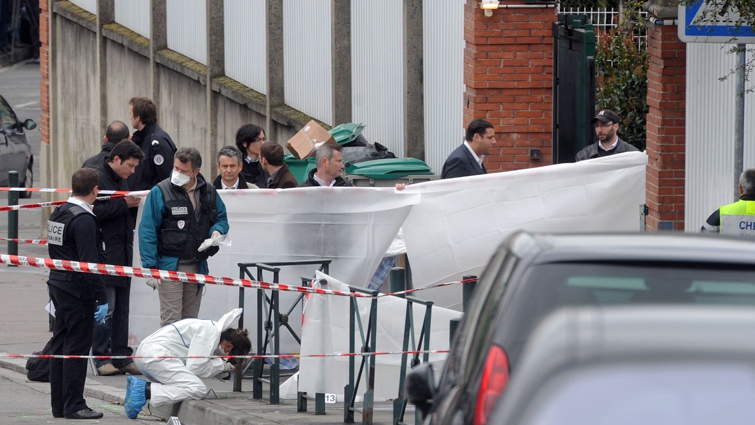 Investigators work at the Jewish school in Toulouse, France, where four people were killed and two seriously wounded Monday.