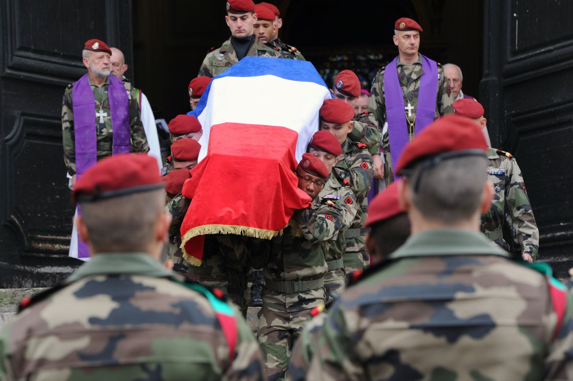 French 17th Parachute Engineer Regiment paratroopers carry the coffin of Abel Chennouf during his funeral at the Montauban cathedral on Wednesday. He was killed in the second attack in Montauban on March 15.