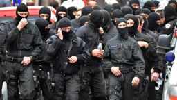 French members of the RAID special police forces unit leave after the assault on shooting suspect Mohammed Merah on March 22, 2012